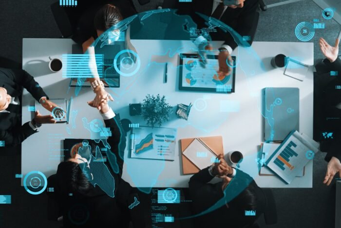 Top down aerial view of skilled business team listening manager present global networking system while giving a high five to encourage or motivate team. Hologram of internet connection. Directorate.
